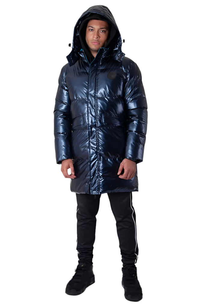Person wearing a shiny navy winter coat on a white background